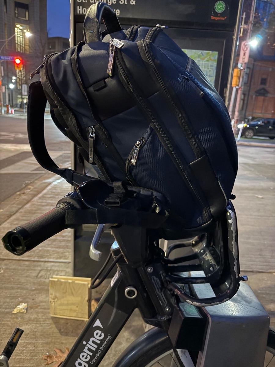 Backpack in the existing Toronto Bike Share basket